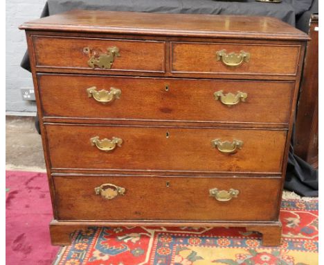 A George III oak chest, the moulded rectangular top above two short and three long drawers, on bracket feet, 93cm wide.