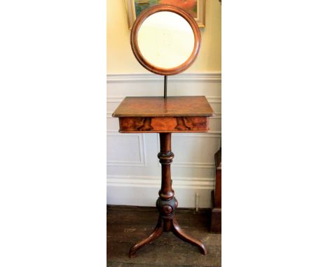 A Victorian walnut shaving stand, circa 1870, with adjustable circular mirror, the rectangular divided hinged top enclosing a
