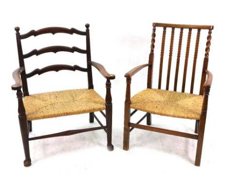 A George III style oak frame ladder back low rush seated elbow chair, circa 1900, and a similar style and period stained beec