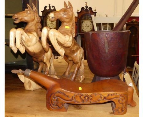 A pair of contemporary carved teak model rearing horses; together with an oversized pestle and mortar; and a hardwood stool (