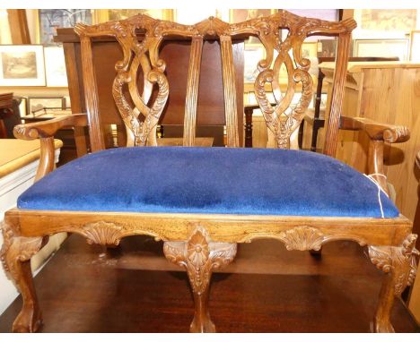 A carved floral hardwood child's two seat settee, in the Chippendale taste, width 59cm