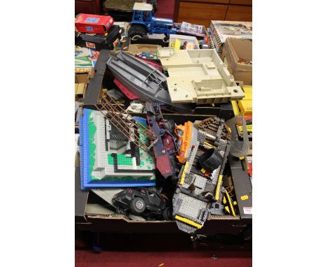Two trays containing a large quantity of Lego and others, together with various Action Man figures etc
