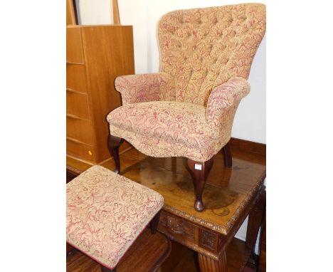 A contemporary red floral needlework fabric upholstered button back armchair, width 72cm, together with a similar footstool, 