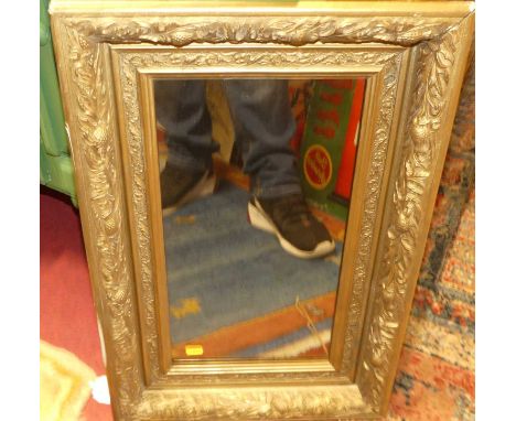 A gilt framed and bevelled rectangular wall mirror, 105 x 74cm; together with another similar; and a circa 1910 smaller examp