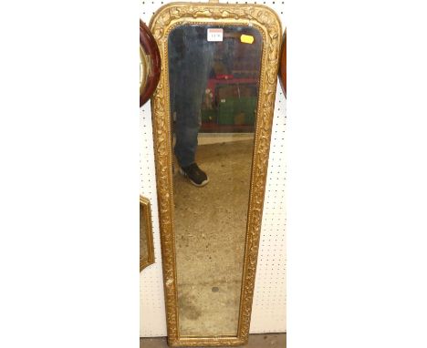 A 19th century floral giltwood and gesso decorated marginal wall mirror, 106 x 28cm 
