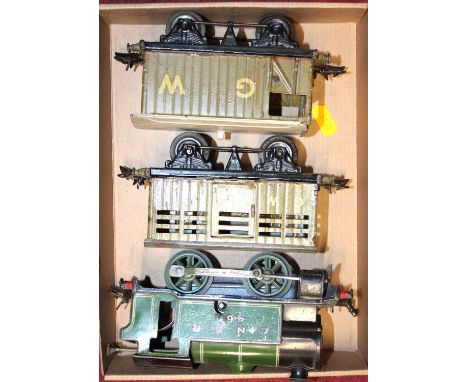 A Hornby Meccano clockwork model of LNER 460 in green; together with two GWR coaches 