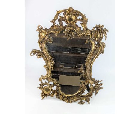 A large brass easel mirror, 19th century, in the Rococo taste, decorated with C-scrolls and rocaille, 67 x 53cm