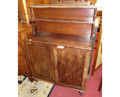 A George IV mahogany chiffonier, having two-tier open superstructure over twin cupboard doors to turned supports, width 91cm,
