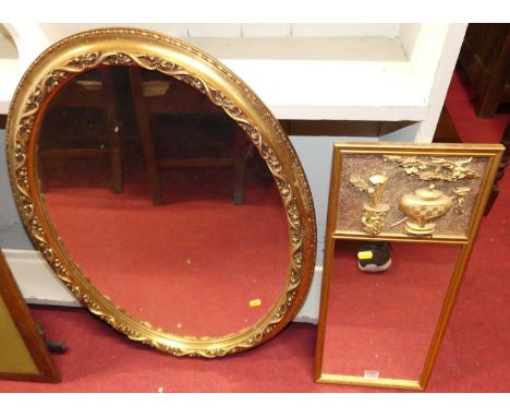 A contemporary floral gilt decorated oval wall mirror, 79 x 58cm; together with a gilt rectangular wall mirror in the Chinese