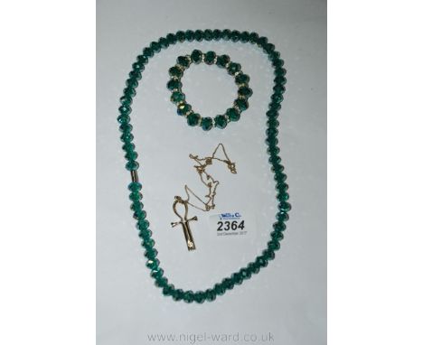 A Tree of life necklace from New Zealand together with a necklace and a bangle