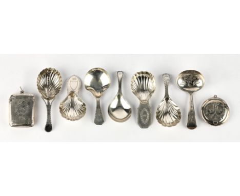 A collection of six caddy spoons by William Brockwell, C.1780, another by John Bourne, a foliate engraved vesta case, and a c