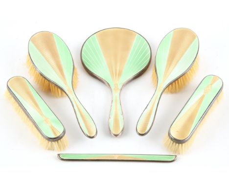 Art Deco yellow and green guilloché enamel dressing table set, with hand mirror, two hair brushes, two clothes brushes and a 