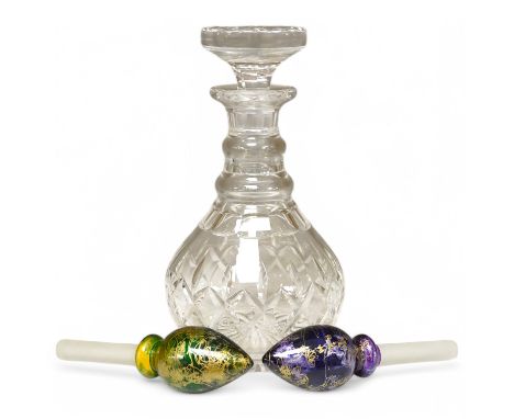 A Stuart crystal decanter and stopper together with two coloured glass boxed stoppers, 23cm high. Condition - good