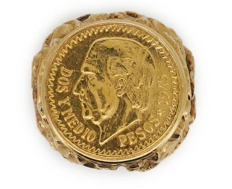 A gold peso coin ring, set with a Mexican 2.5 peso coin dated 1945, in an elaborate gold mount of Baroque inspiration, size K