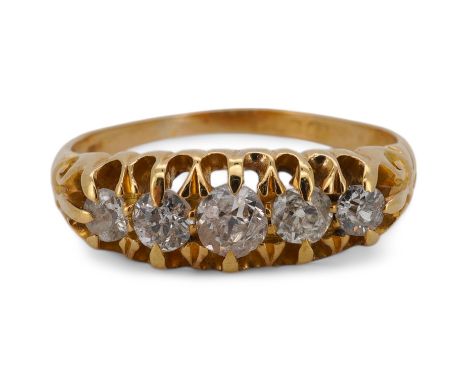 An Edwardian 18ct gold and graduated five stone diamond set half hoop ring, size P, gross weight 3.5 grams. Condition - fair 
