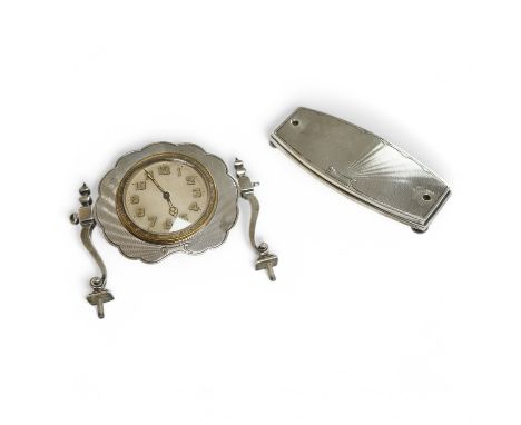 A George V engine turned silver bedside timepiece, lacking fixings, Birmingham, 1928,  base 10.6cm.  Condition - poor to fair