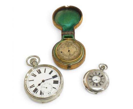 A nickel cased Goliath pocket watch, a Swiss 935 standard half hunter pocket watch and a cased brass barometer. Condition - p
