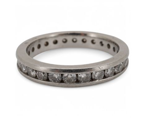 A diamond eternity ring, channel-set with a continuous band of brilliant-cut diamonds totalling approximately 1.20 carats, mo