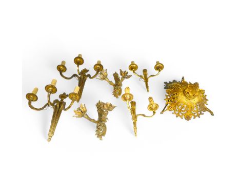 An ormolu ceiling light, a pair of three branch sconces and two pairs of two light sconces, largest 38cm high. Condition - va