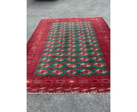 A Bokhara green ground carpet, 330 x 244cm. Condition - good