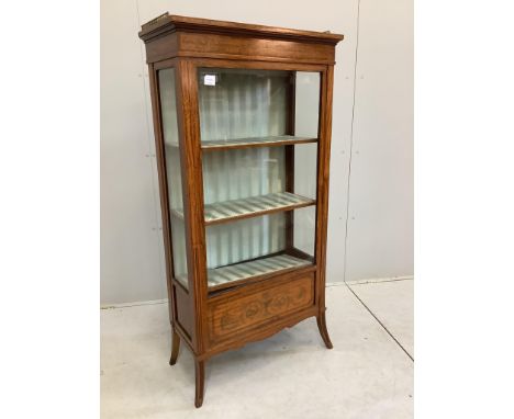 An Edwardian marquetry inlaid satinwood vitrine, bears Maple & Co. trade label, width 73cm, depth 36cm, height 148cm. Conditi