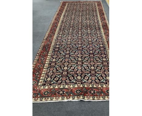 A Hamadan blue ground hall ground carpet, 430 x 160cm. Condition - good