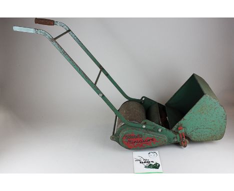 A Webb children's miniature lawnmower with leaflet