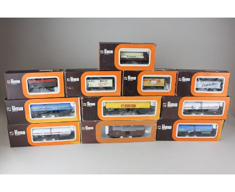 Eleven Lima '00' gauge model railway rolling stock, trucks, tankers and wagons, all boxed
