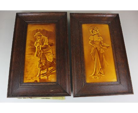 A pair of English ceramic wall tiles, indistinctly signed, of a flower seller and a shepherdess, in honey coloured glaze, and