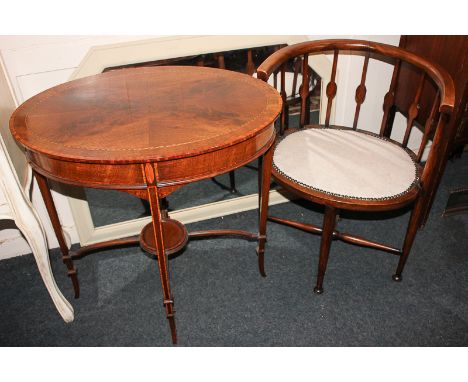 An oval seated tub chair, and an inlaid mahogany oval side table (a/f) 67cm