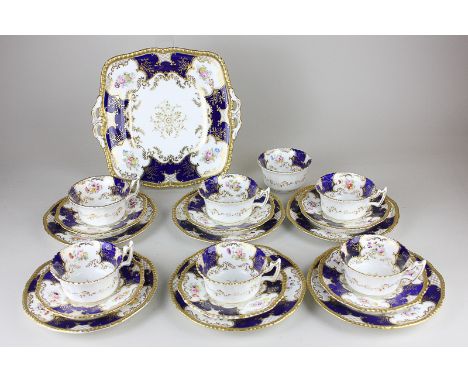 A Coalport porcelain part tea service comprising of six cups, saucers and tea plates,  a sugar bowl and sandwich plate in ric