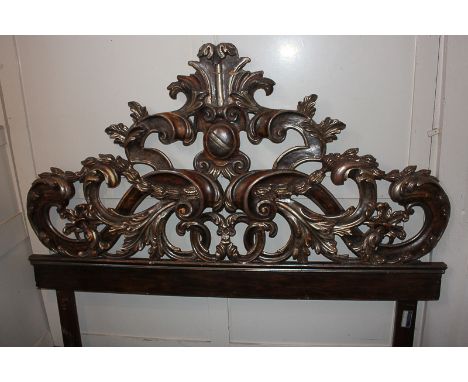 A giltwood and gesso scroll and foliate double headboard, surround reattached (a/f) 180cm