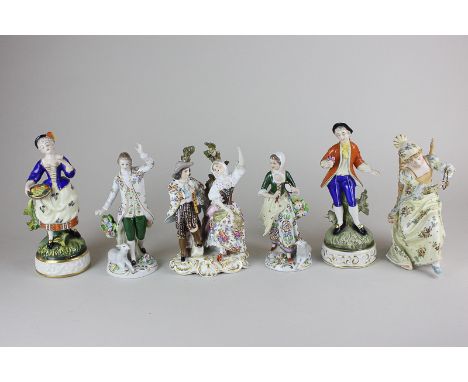 A pair of Sitzendorf porcelain figures of a lady with tambourine and man dancing both with lambs at their feet, a German porc