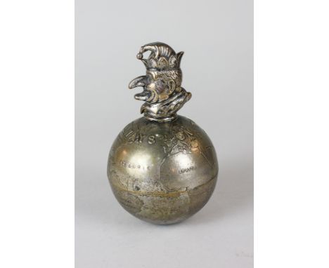 A novelty silver plated brass paperweight modelled as a globe surmounted by the head of Mr Punch, stating 'Always on Top' by 