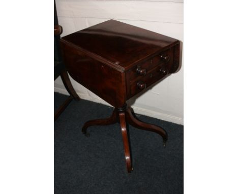 A drop flap side table, two drawers, on pedestal support