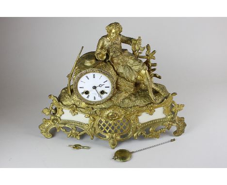 A gilt brass mantle clock, the drum cased bell striking movement and dial signed Henry Marc Paris, the case with a reclining 