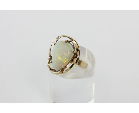 An opal dress ring in 9ct gold