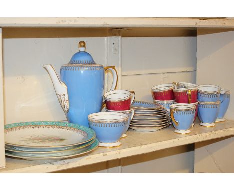A set of three Royal Worcester cabinet plates with hand painted floral designs and turquoise borders, impressed mark, togethe