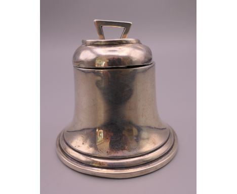 A silver bell form inkwell.  5 cm high.