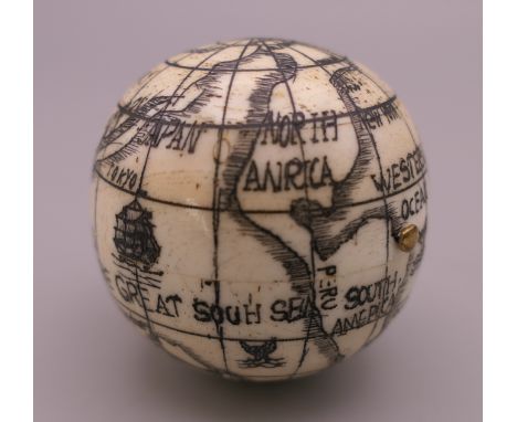 A bone globe compass.  4 cm high. 