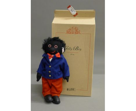 A Steiff Golly Boy, limited edition, numbered 897/2000, with original box and certificate. 