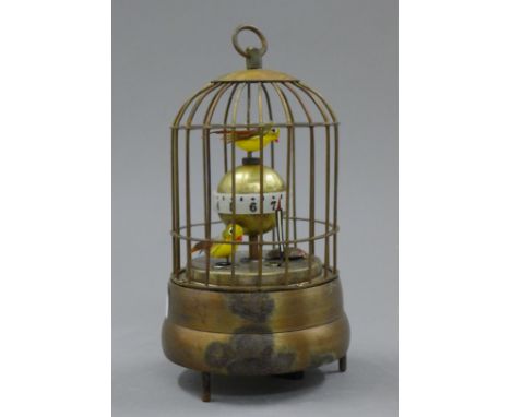 A birdcage clock. 16 cm high.