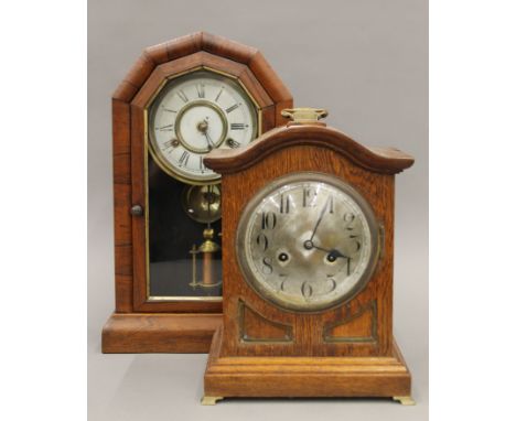 A 19th century rosewood cased mantle clock and an oak mantle clock. The former 44.5 cm high.