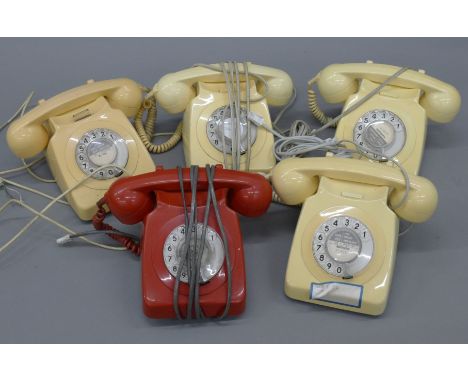 A box of vintage telephones.