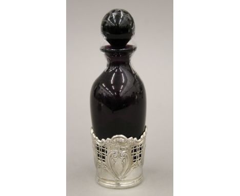 A silver mounted amethyst glass scent bottle. 16.5 cm high.