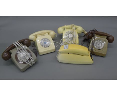 A box of vintage telephones.
