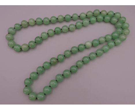 A string of jade beads.  Approximately 84 cm long. 