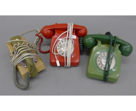 A box of vintage telephones.