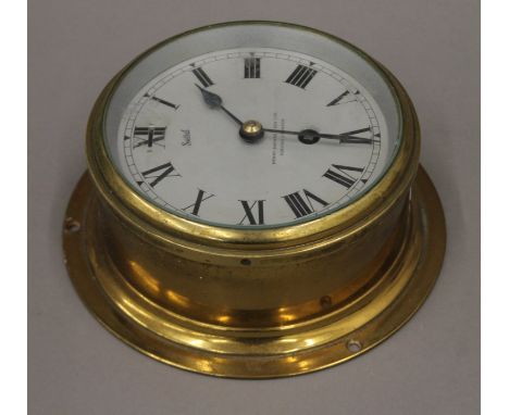 A Sestrel, Henry Browne &amp; Son Ltd, Barking &amp; London brass bulkhead clock. 17.5 cm diameter.