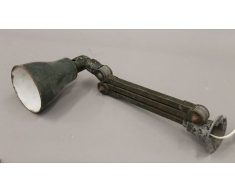 A vintage wall mounted machinist lamp. 